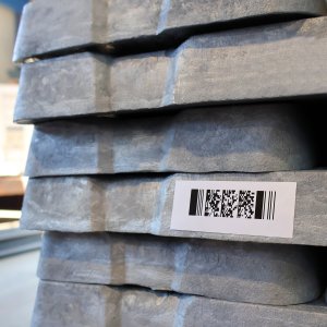 Close-up of aluminium ingots with a label